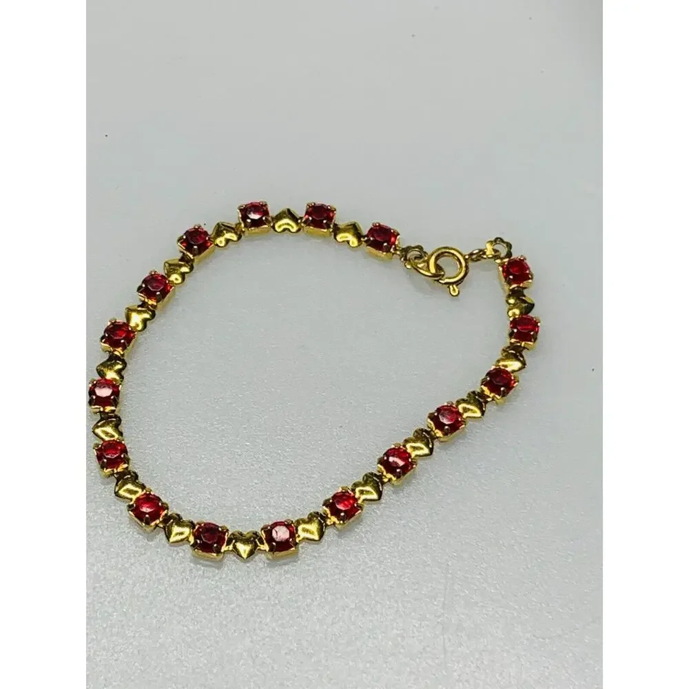 Red Stone Tennis Bracelet with Little Gold Hearts in Between Each Stone